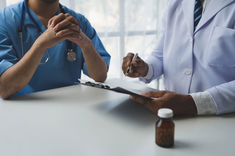 A doctor working with medical device consulting team