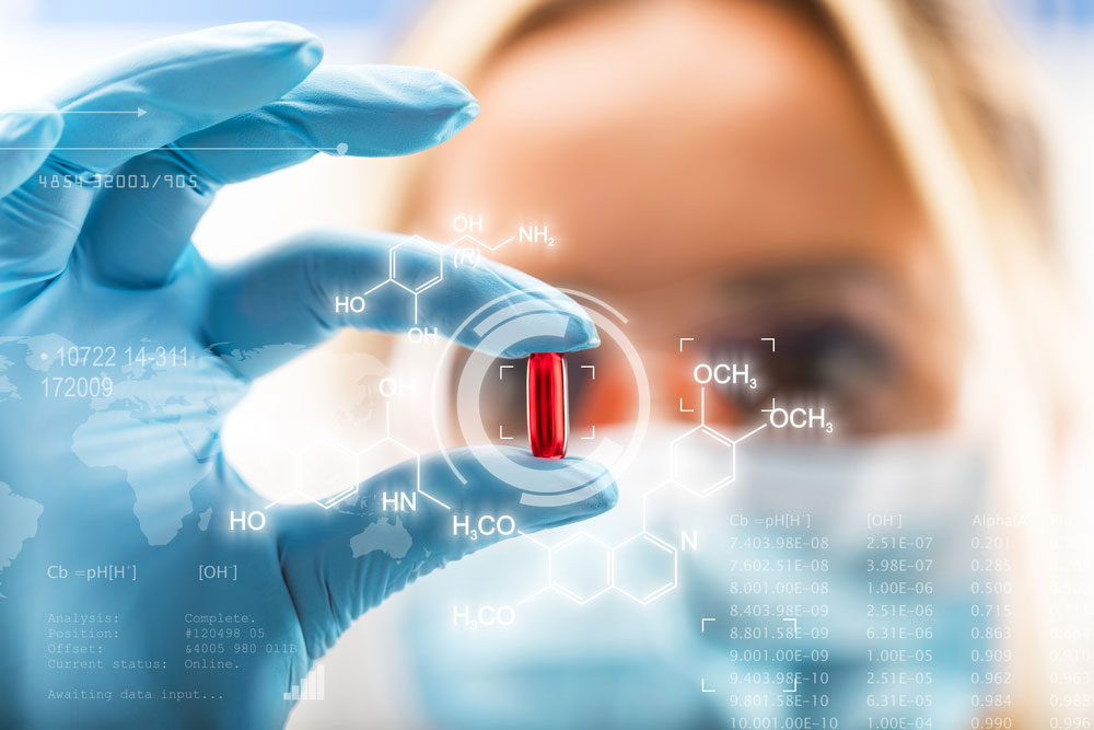 A scientist inspecting a medical pill for TGA approval